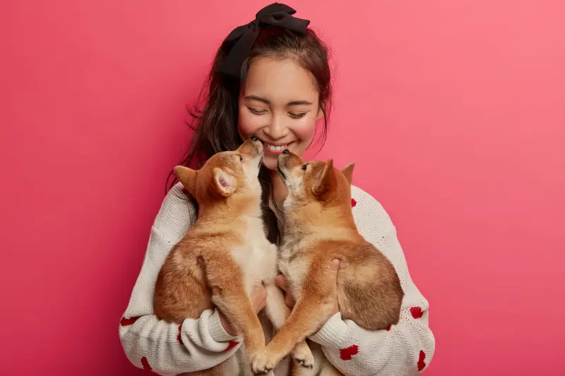 Woman with two puppies